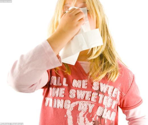 A person managing cold and flu symptoms at home