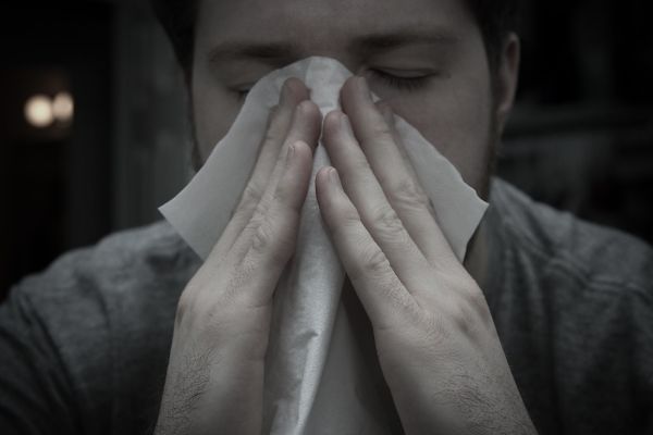 A person easing sinus congestion at home